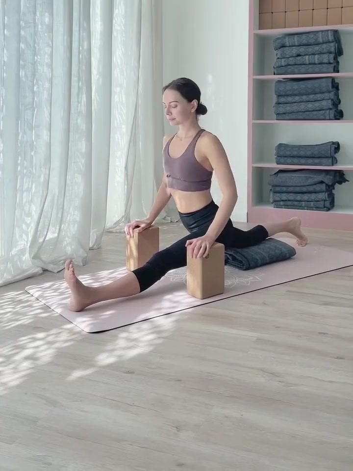 A supported yoga stretch inside Akasa’s studio